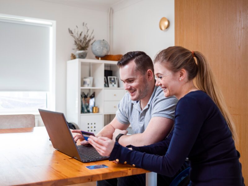 Smiling,Couple,Online,Shopping,At,Home